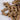 Brown dog treats shaped like bones on a white background