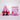 Pink packages of Serrano Chicken treats on a white background
