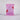 Pink package of Serrano Chicken Treats on a light gray background